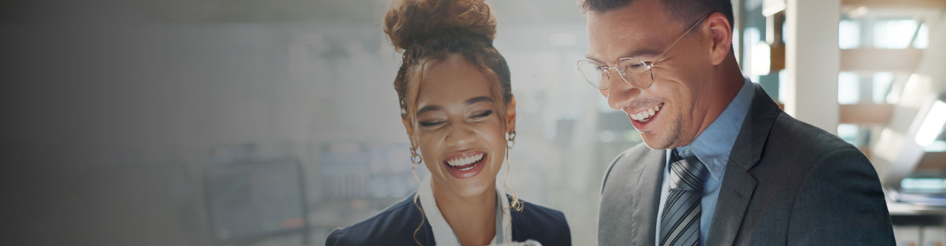 Smiling colleagues working together in a modern office.